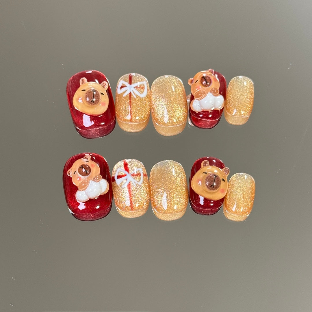 3. "Stylish Christmas Red Chrome PressOn Nails Featuring Glitter and Bow Accents"