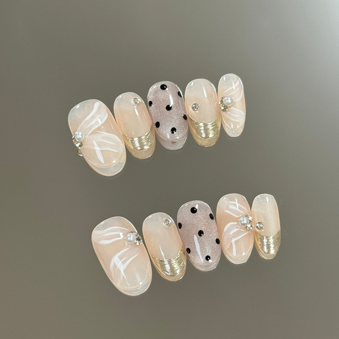 1. "Nude Pink Short Oval Press On Nails with Polka Dot Design for a Chic Look"