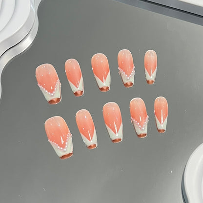 2. Stylish Pink French Tip PressOn Nails with a Modern Coffin Shape