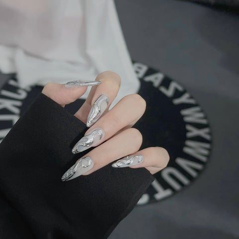 2. Short Almond Shaped Chrome Nails with a Modern Gothic Aesthetic