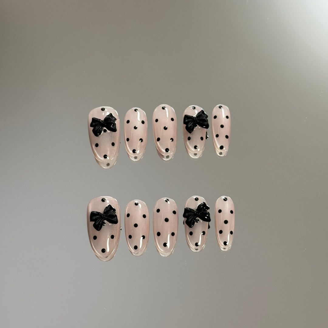 3. "Elegant PressOn Nails with a Playful Pink Polka Dot Accent"