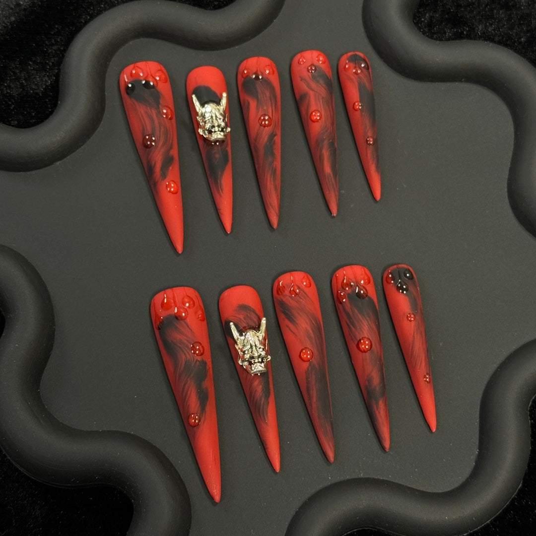 2. Spooky Halloween presson nails featuring adorable monster motifs in a sleek matte finish.