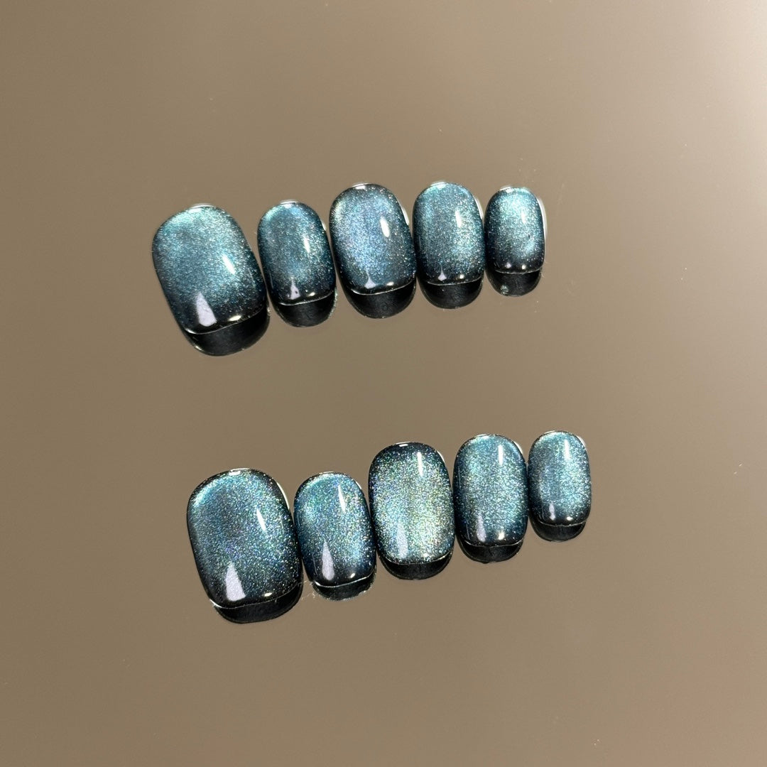 products of images_1: Glittery Blue Cat Eye Short Round Nail Art