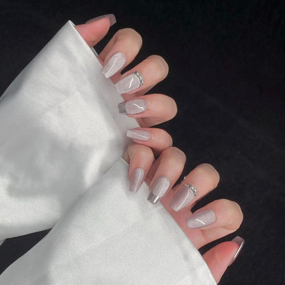 2. "Glamorous French Tips with Pink Cat Eye Effect for Coffin Nails"