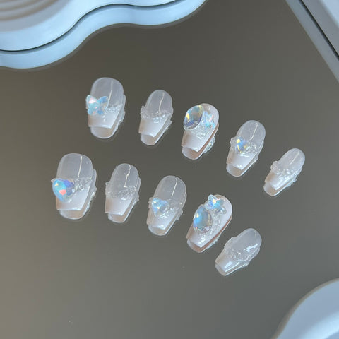 1. Elegant Milky White Coffin Nails with Sparkling Diamonds for a Royal Look.