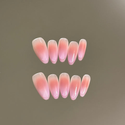 2. Handcrafted Short Almond PressOn Nails in a Vibrant Pink Chrome