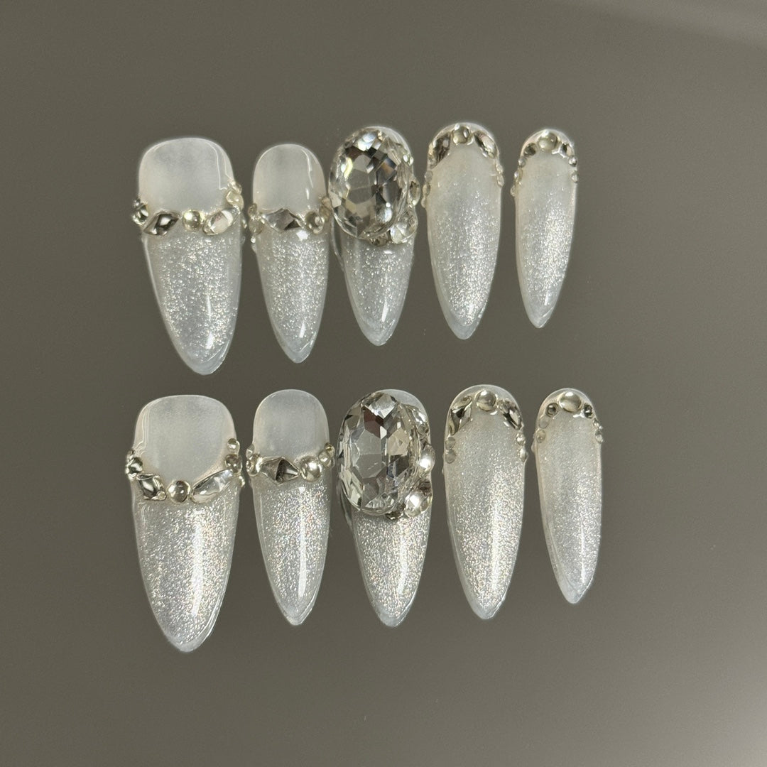 3. Exquisite white to silver ombre presson nails, almond shape, ideal for a sophisticated wedding day.