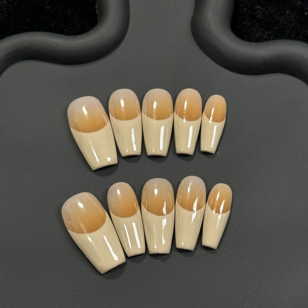 1. Khaki medium coffin nails with a glossy ombre french tip design for a chic and sophisticated look.