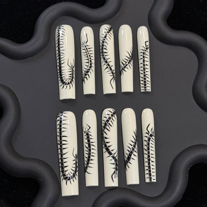 2. Sleek square nail design featuring a striking millipede motif, a musthave for insect nail art lovers.