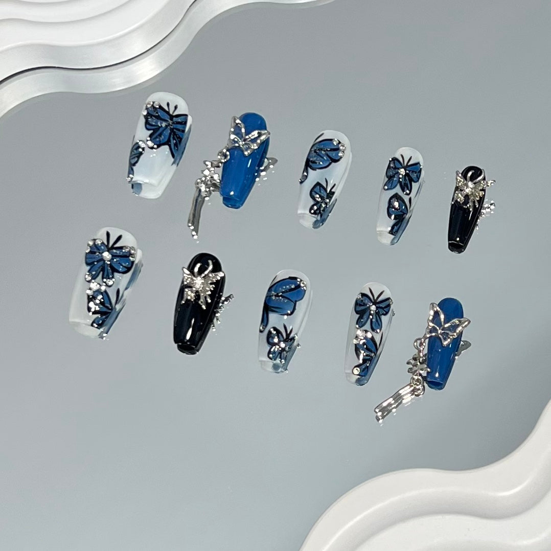 2. Exquisite baby blue and gold butterfly pattern on presson medium coffin nails for a unique fashion statement.