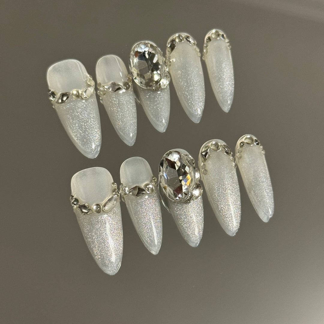 2. Reusable white and silver cat eye ombre presson nails, perfect for a chic bridal look.