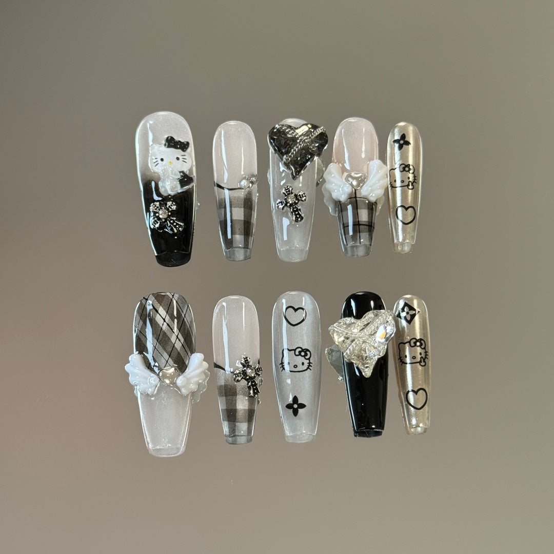 3. Stylish Short Coffin Nails with Hello Kitty Black and White Nail Art