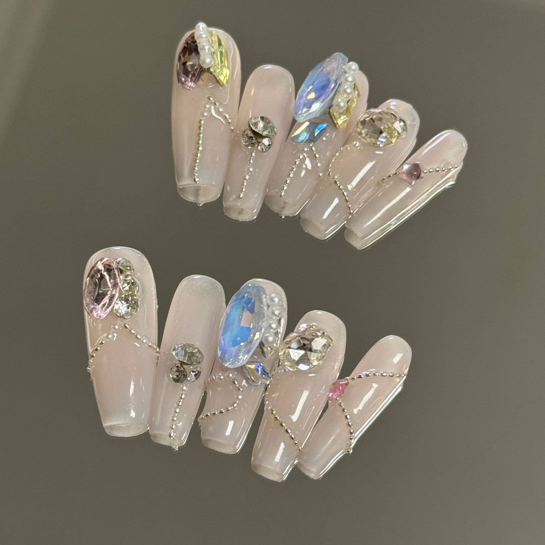 2. Stylish PressOn Nails in Pink Chrome Finish with Sparkling Gemstone Accents for a Luxe Look