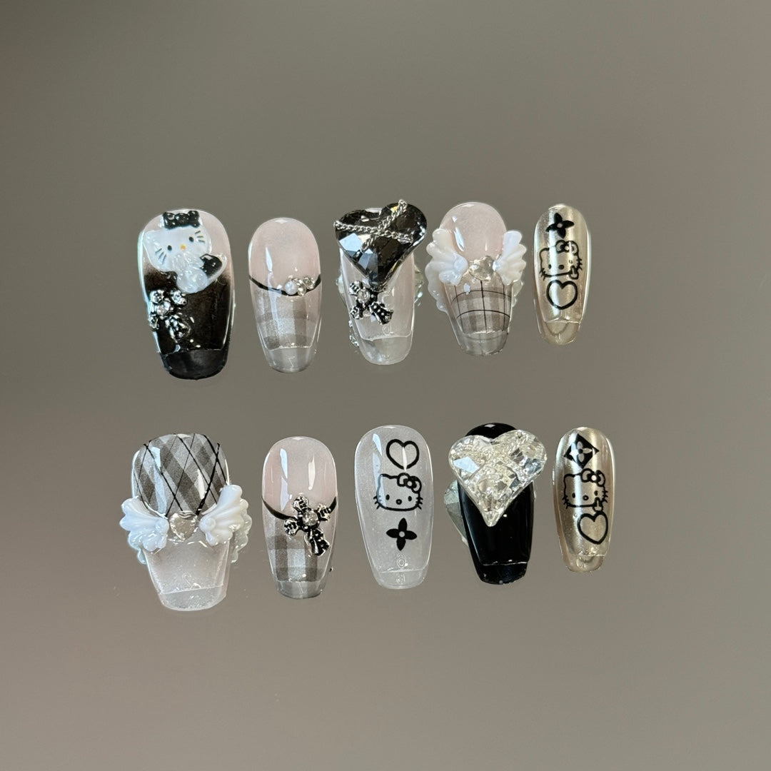 1. Adorable Hello Kitty Inspired Short Coffin PressOn Nails with Black and White Designs