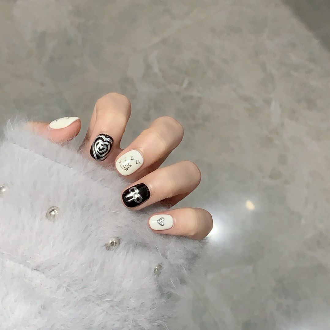 3. "Black and White Cat Eye Short Acrylic PressOn Nails for a Bold Look"