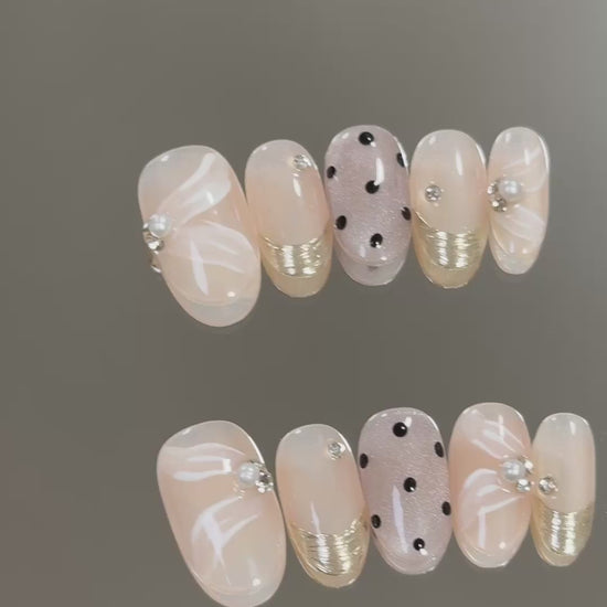 3. "Stylish Short Oval Nude Pink Press On Nails with Begonia Dot Pattern for Sophistication"