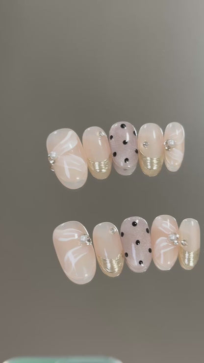 3. "Stylish Short Oval Nude Pink Press On Nails with Begonia Dot Pattern for Sophistication"