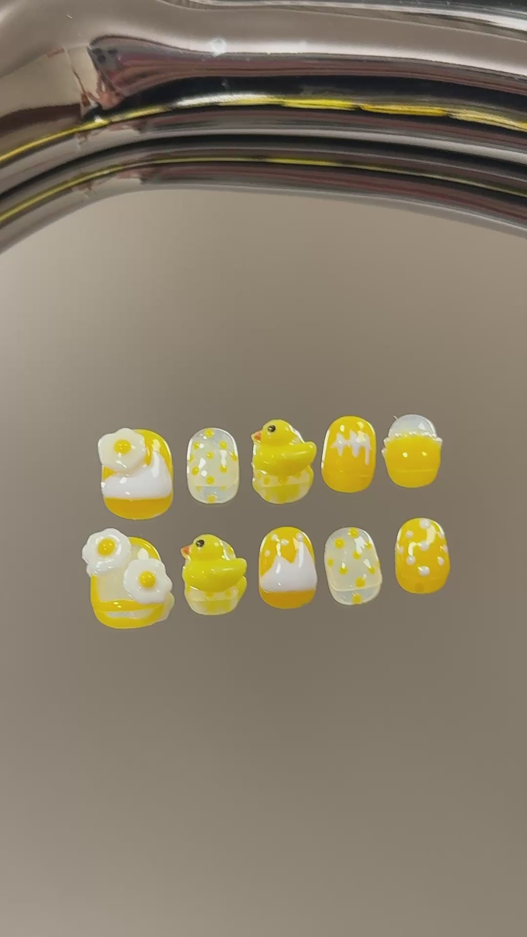 3. Safe and secure nail adhesive for fake nails, designed for short and round nail shapes in a cheerful yellow.