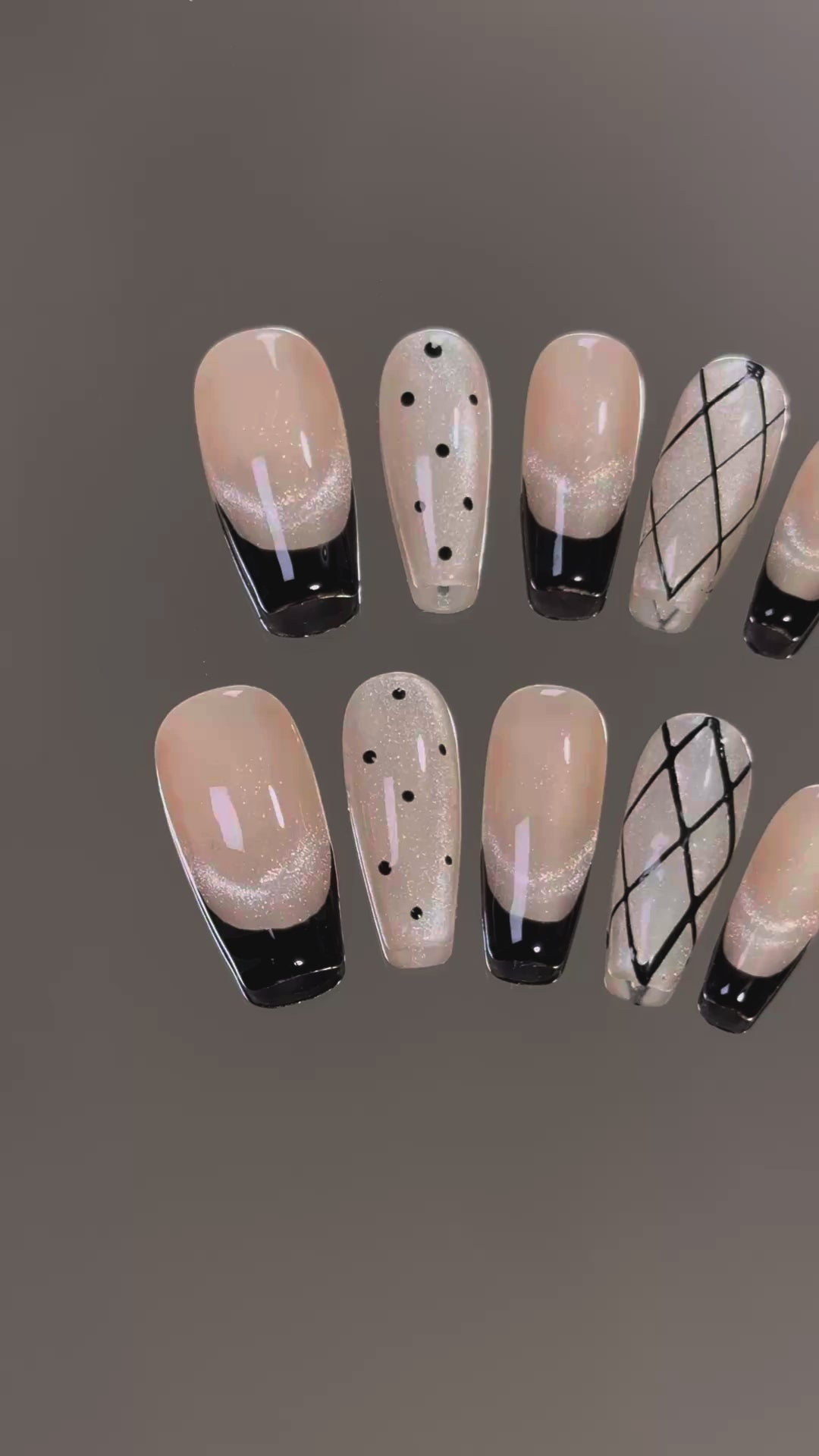 4. Elegant and edgy black coffin nails with a touch of glitter for a glamorous finish.