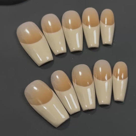 2. Effortlessly elegant, these presson nails feature a simple fake nail design in a khaki hue with a glossy finish.