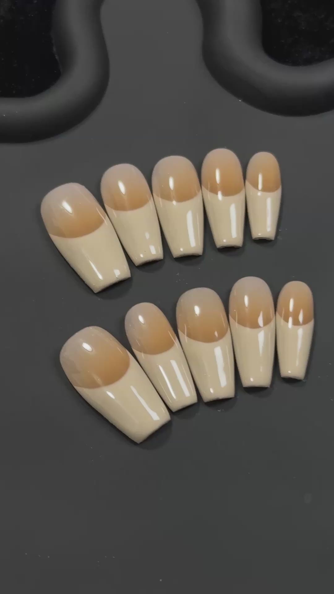 2. Effortlessly elegant, these presson nails feature a simple fake nail design in a khaki hue with a glossy finish.