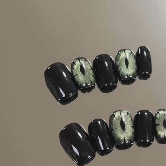 3. Stylish black glitter presson nails for a spooky yet fashionable Halloween.