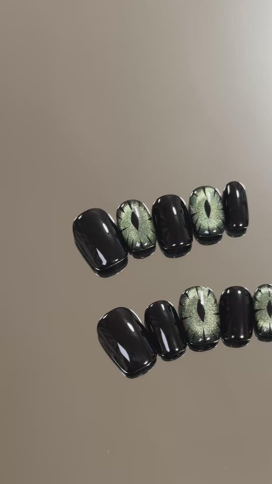 3. Stylish black glitter presson nails for a spooky yet fashionable Halloween.