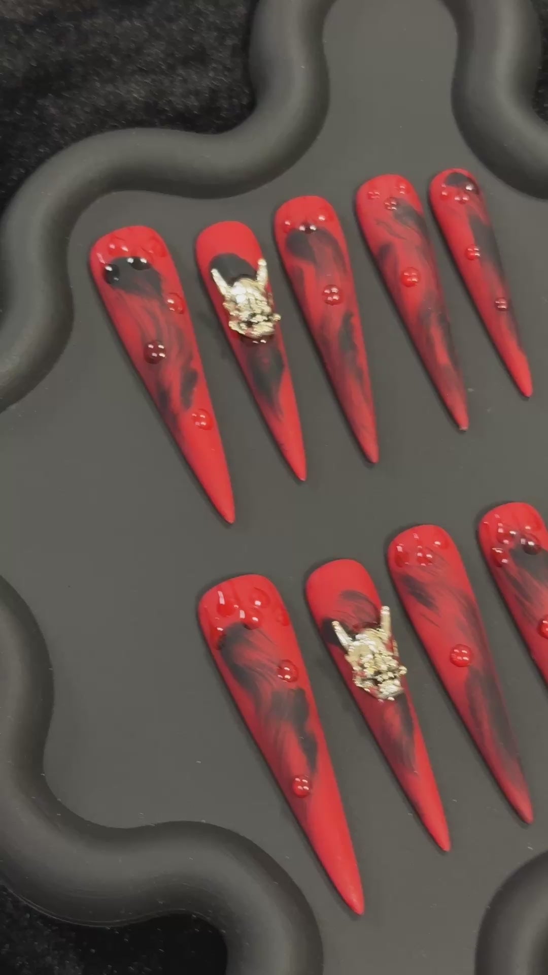 3. Stylish matte black monsterthemed stiletto nails perfect for a hauntingly fun Halloween.