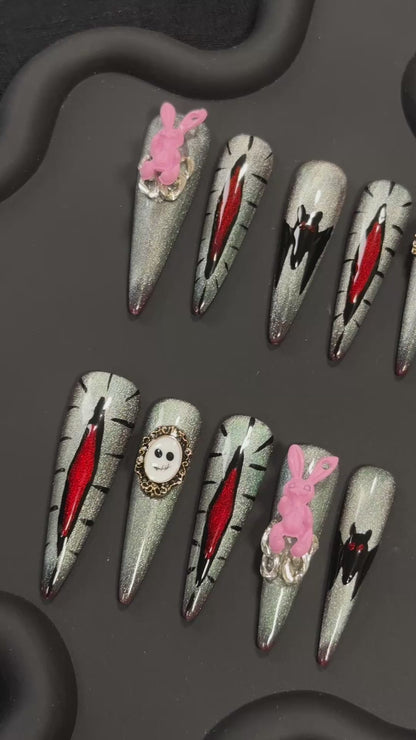 4. Halloween Themed Glitter Bat Stiletto Nails for a Stylish Look