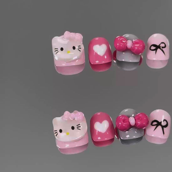 3. "Adorable Hello Kitty Bow Design Chrome PressOn Nails with a Shiny Pink Finish for Short Nails"