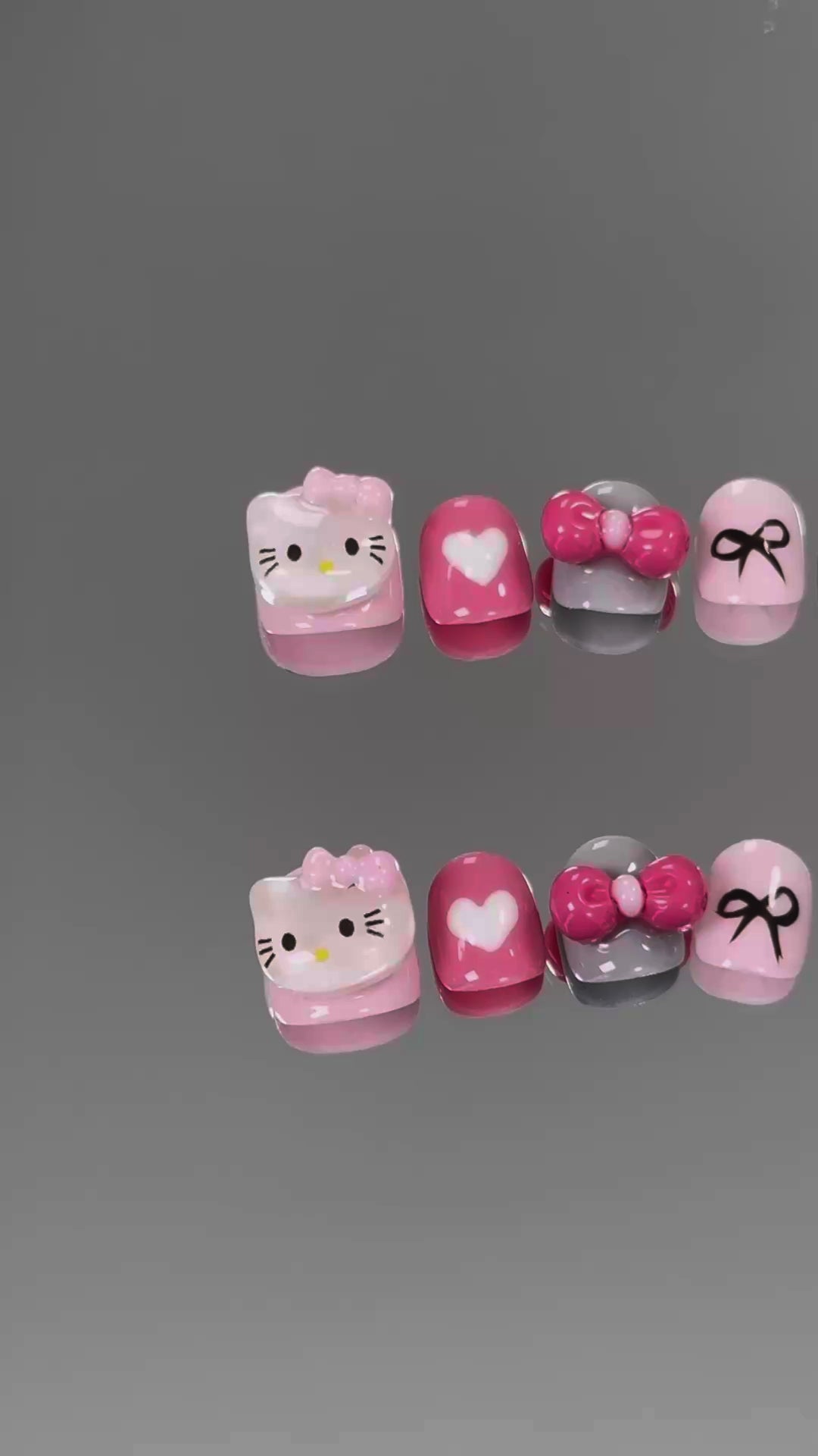 3. "Adorable Hello Kitty Bow Design Chrome PressOn Nails with a Shiny Pink Finish for Short Nails"