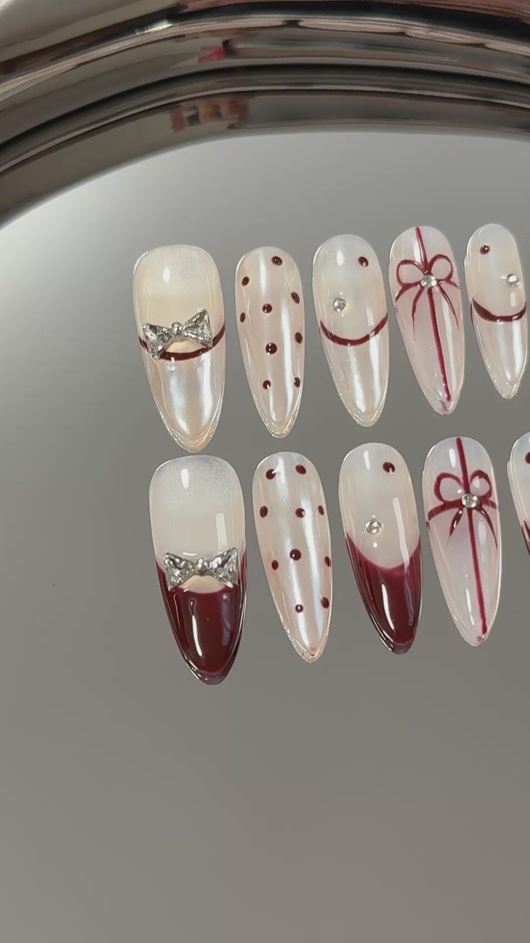 3. Elegantly designed presson nails in a medium almond shape, accentuated with a trendy French tip for a festive Christmas vibe.