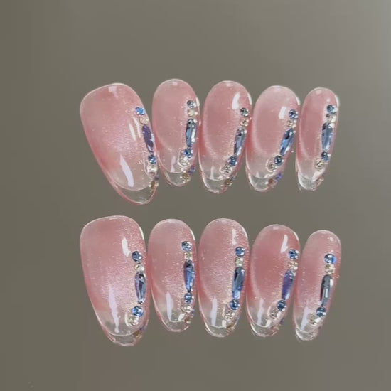 2. Trendy almond cateye nails featuring hot pink tips, perfect for a chic and vibrant look.