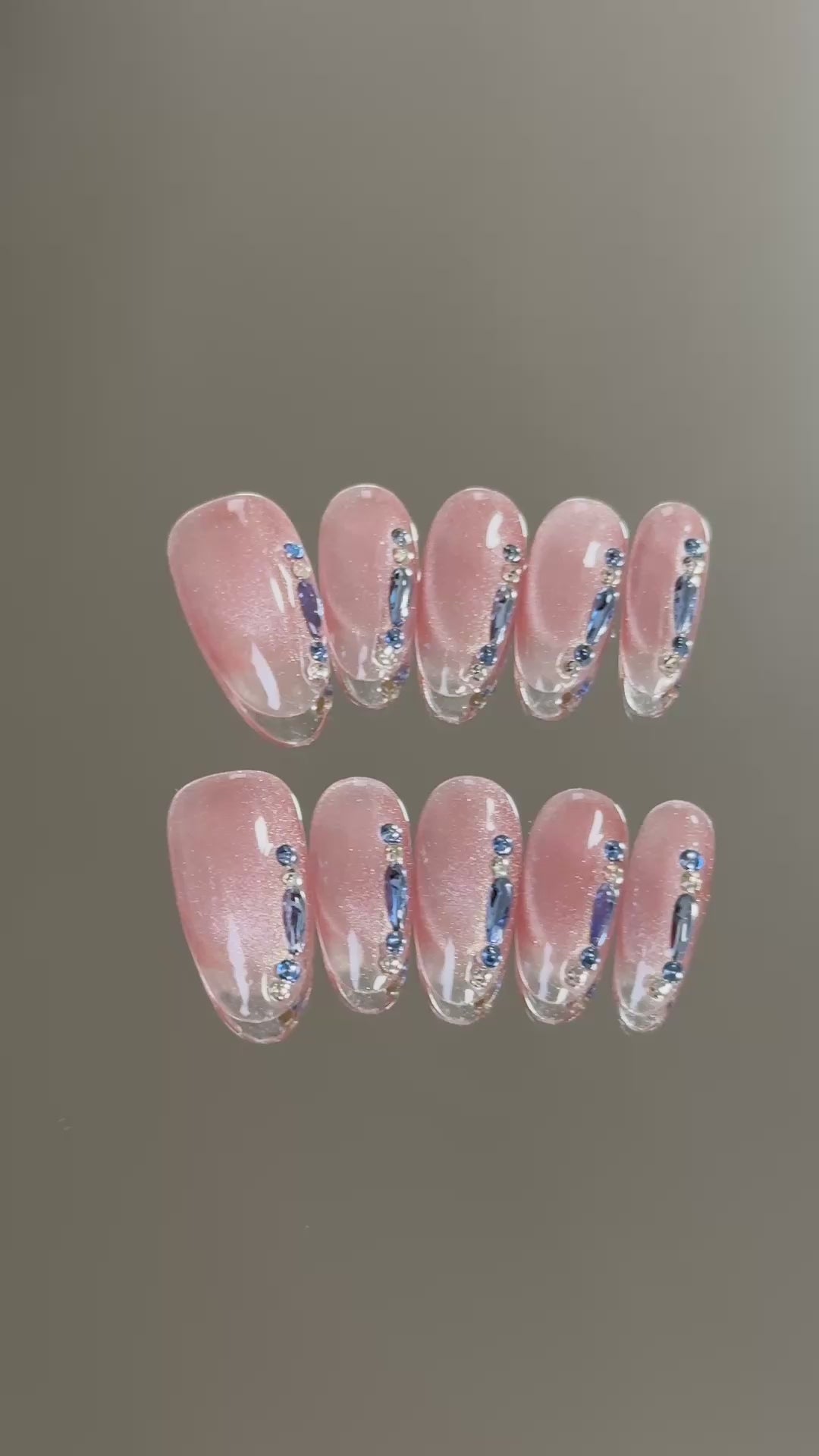 2. Trendy almond cateye nails featuring hot pink tips, perfect for a chic and vibrant look.