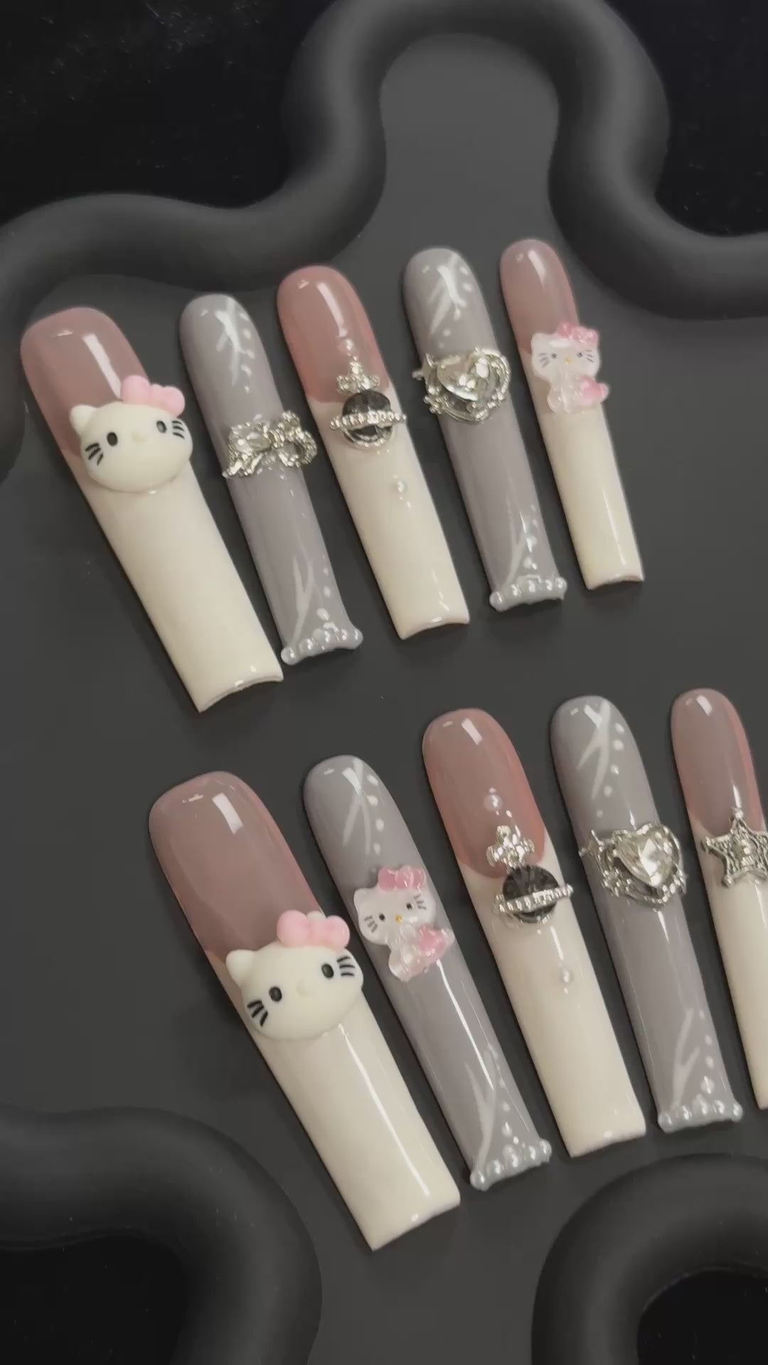 2. "Stylish Hello Kitty Brown & White Acrylic Nails, Perfect for FashionForward Looks"