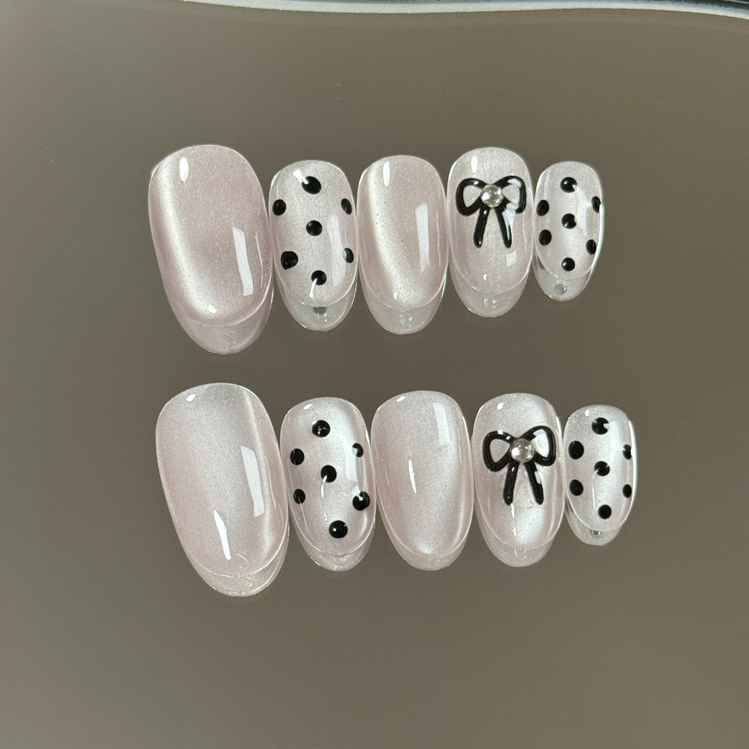 3. Elegant PressOn Nails with a Touch of Pink Chrome and Intricate Polka Dot Pattern