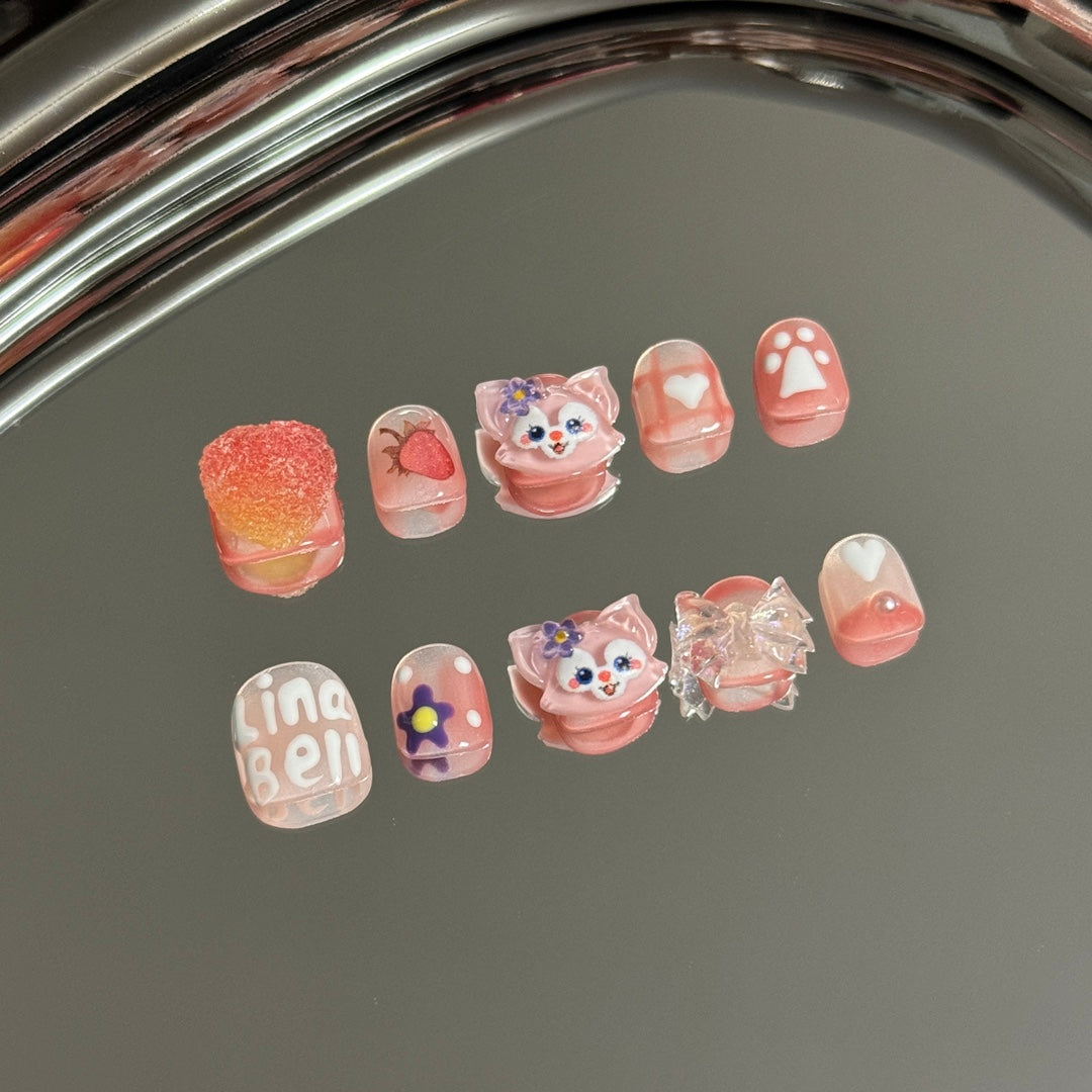 1. Adorable cartoon character presson nails in a vibrant pink chrome finish, perfect for a kidfriendly nail salon experience.