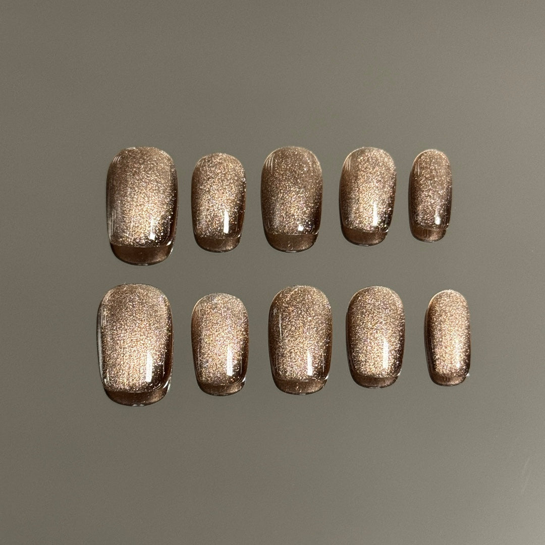 2. "Instant Fashion Upgrade: Brown Glitter Cat Eye Nails"