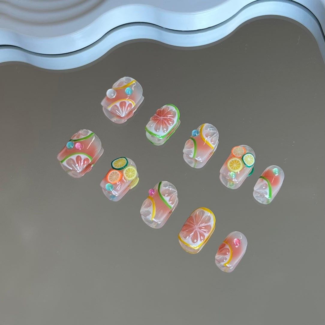 3. "Cute summer short presson nails with glossy lemon fruit accents"